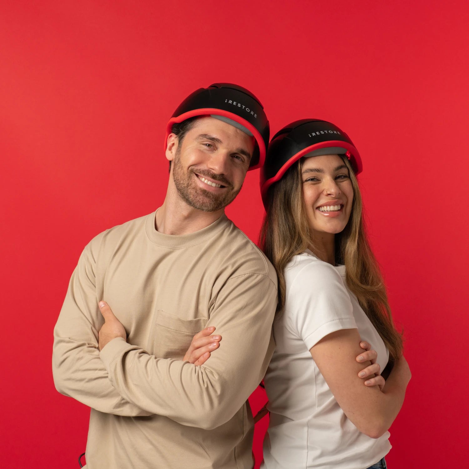 Man and woman wearing the elite hair device.